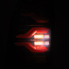 AlphaRex 05-15 Toyota Tacoma LUXX LED Taillights Blk/Red w/Activ Light/Seq Signal - Mo-Moto