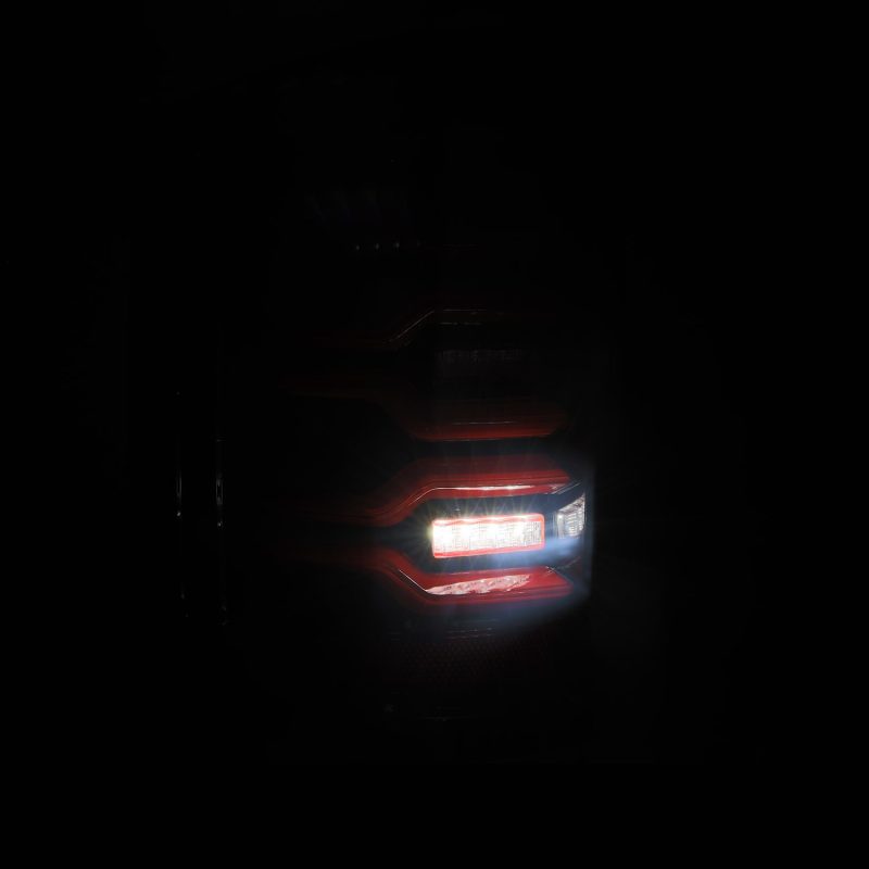 AlphaRex 14-18 Chevy Silverado 1500 Luxx-Series LED Tail Lights Black/Red w/Activ Light/Seq Signal - Mo-Moto
