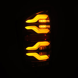 AlphaRex 16-21 Toyota Tacoma LUXX LED Taillights Alpha Blk w/Activ Light/Seq Signal - Mo-Moto
